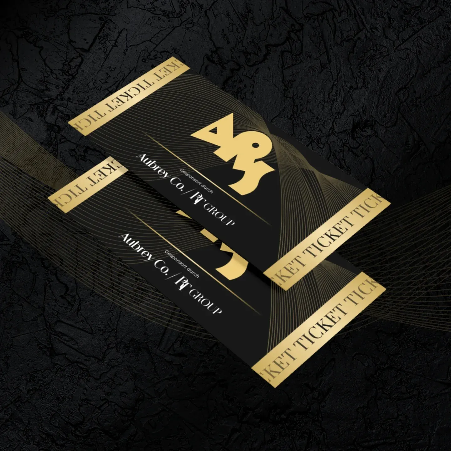 Schwarz-goldene Tickets mit dem Schriftzug Aubrey Co.